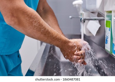 male doctor wash hands before surgery operation, clean the dirt. in sterile operating room - Powered by Shutterstock