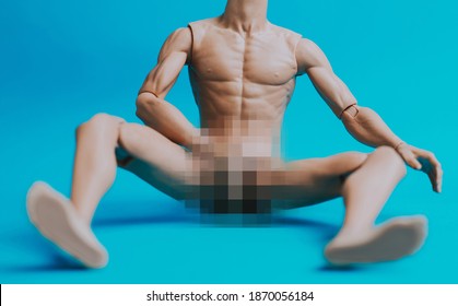 Male doll on a blue colored background. mannequin with body parts blurred out with pixelation technique