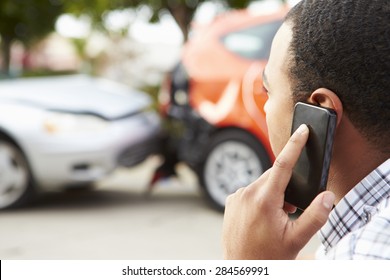 Male Driver Making Phone Call After Traffic Accident