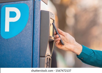 Male Driver Pays For Parking Space Car Contactless Payment From Phone.