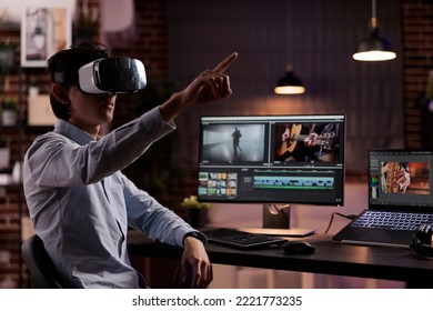 Male editor working on media production with vr headset and creative software, editing movie footage or film montage on computer. Creating video edit with audio and visual effects on monitor. - Shutterstock ID 2221773235