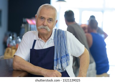 Male Elderly Bar Keeper Posing