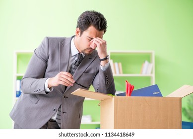 Male employee collecting his stuff after redundancy - Shutterstock ID 1134418649