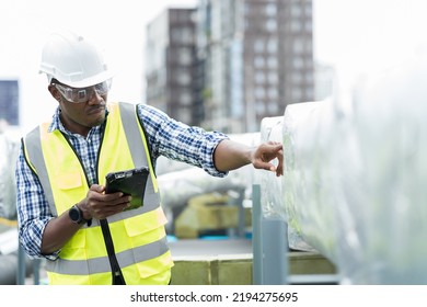 Male engineer checking or maintenance pipe system for ventilation and air conditioning on rooftop of building - Powered by Shutterstock