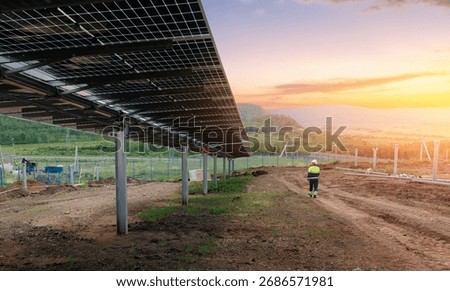 Male engineer going for install solar panels on power station or gold mining.