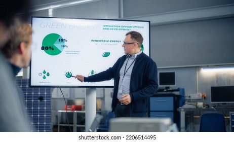 Male Engineer Points at Big Screen With Presentation and Talks About Green Energy and Solar Panels Future Possibilities. Engineering and Sustainable Energy Education Concept. - Powered by Shutterstock