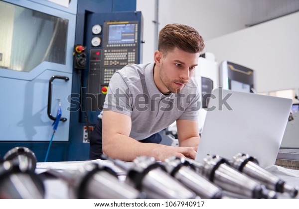 Male\
Engineer Using CAD Programming Software On\
Laptop
