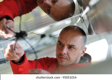 Male Engineer At Work Place, Solar Panels Plant Industry In Background