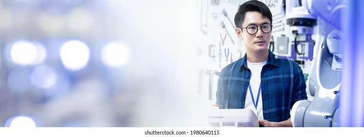 Male Engineers Maintenance Robot Arm at Lab. he are in a High Tech Research Laboratory with Modern Equipment.Professional Japanese Development Engineer is Testing an Artificial Intelligence.start up. - Powered by Shutterstock