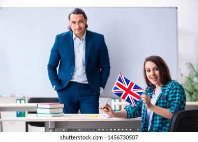 Male English Teacher And Female Student In The Classroom 