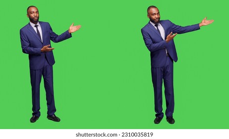 Male entrepreneur creating advertisement on camera, talking about something on left or right sides. Professional company manager doing ad presentation over full body green screen. - Powered by Shutterstock