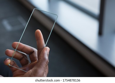 Male executive using mobile phone in futuristic office - Powered by Shutterstock