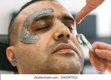 Male Face Waxing. Barber Removes Hair By Shugaring From Face Of Turkish Man.