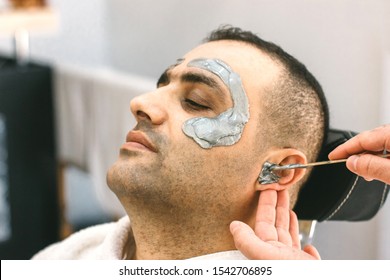 Male Face Waxing. Barber Removes Hair By Shugaring From Face Of Turkish Man.