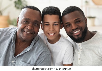 Male Family Members. Portrait Of Handsome African American Grandfather, Father And Son Smiling At Camera, Posing For Photo At Home, Closeup