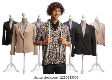 Male fashion designer with a measuring tape and doll mannequins isolated on white background - Powered by Shutterstock