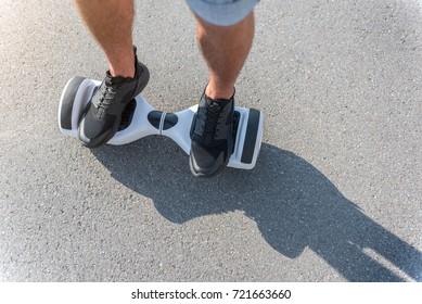 Male Feet Going On Hoverboard At Street