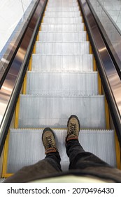 Male Feet On The Escalator, Top View.