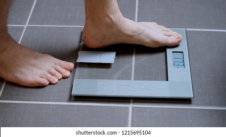 Male Feet On Glass Scales, Men's Diet, Body Weight, Close Up, Man Stepping Up On Scales, Side View