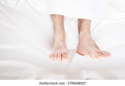 Male Feets On Bed In Morning.