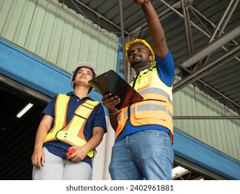 male female african american india person people black skin woman man manager employee staff manager safety yellow hardhat safety checklist report information document tablet order custom shipping  - Powered by Shutterstock