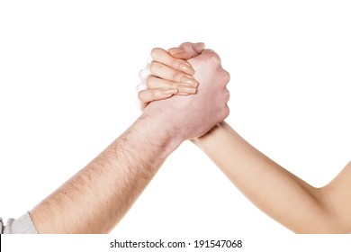 Male And Female Arm Wrestling On The White Background