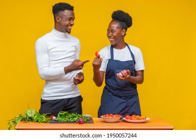 Male And Female Chef Having Fun While Cooking