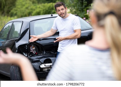 Male And Female Drivers Arguing Over Damage To Cars After Accident - Shutterstock ID 1798206772