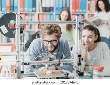 Male And Female Engineering Students Using A 3D Printer In The Lab, Technology And Learning Concept