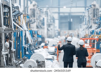 Male and female engineers collaborate with other stakeholders, including suppliers and customers, to ensure the success of the industrial business and its products. - Powered by Shutterstock