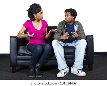 male and female fighting over a video game controller