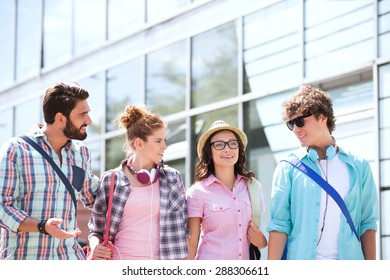 Male And Female Friends Talking Outside Building