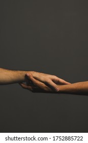 Male And Female Hands With Different Skin Tones Holding Each Other