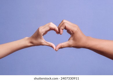 Male and female hands forming a heart shape isolated on gray background - Powered by Shutterstock