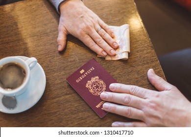 Male And Female Hands With Passport And Money On The Table - Concept Of Illegal Immigration, Sale Of Fake Passports, Sham (fake) Marriage