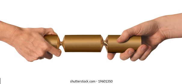 Male And Female Hands Pulling A Gold Christmas Cracker