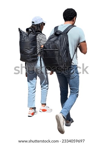 Male and female hikers walking with backpacks on their backs along a street in a city in summer. Side view of isolated cut-out people 