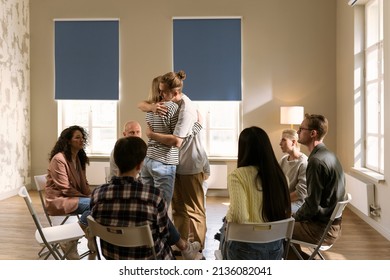 Male and Female Hug Sit in Circle Feel Relief Empathy Helping Friend at With Problems Addiction - Powered by Shutterstock