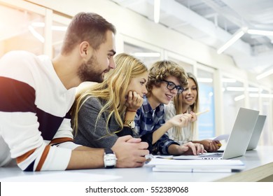 Male And Female International Students Practicing In Graphic Designing Via Special Software Programs Via Modern Laptop Computers And Wireless Connection To Internet Learning In University Classroom