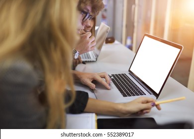 Male And Female International Students Reading Online Manual Book On Business Marketing Lesson Searching Information For Quality Test Control Via Laptop Computer With Mock Up Screen Using Wifi 