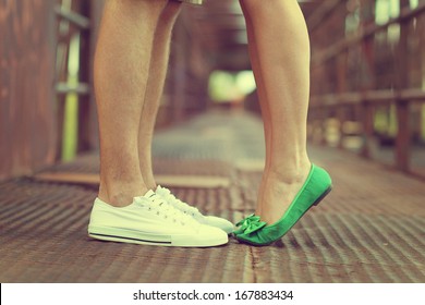 Male And Female Legs And Green Shoes