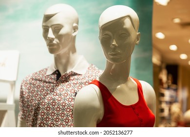 Male And Female Mannequins In The Window Of A Clothing Store. Fashion And Style. Close-up.