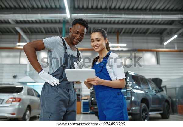 Male and female\
mechanics, car service