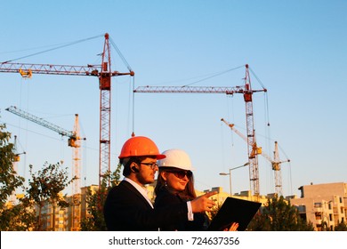male and female on the background of the building - Shutterstock ID 724637356