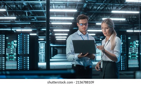 Male and Female Programmers Talking about Work, Solving Problems Together, Using Laptop Computer. Software Development  Code Writing  Website Design  Database Architecture Concept - Powered by Shutterstock