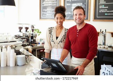 Male And Female Staff In Coffee Shop
