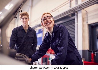 Male And Female Students Looking At Car Engine On Auto Mechanic Apprenticeship Course At College - Shutterstock ID 1705421503