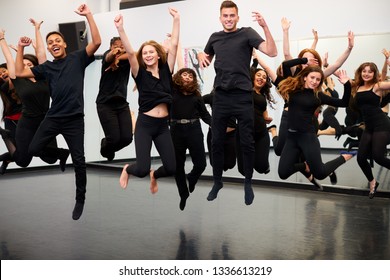 Male And Female Students At Performing Arts School Rehearsing Street Dance In Studio