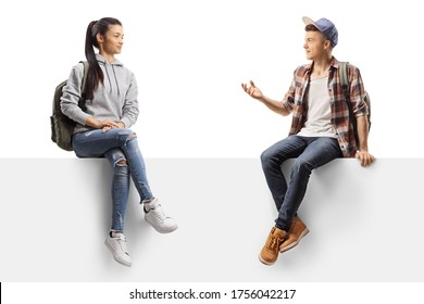 Male and female students sitting on a panel and talking isolated on white background - Powered by Shutterstock