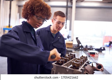 Male And Female Students Work On Car Engine Block On Auto Mechanic Apprenticeship Course At College - Shutterstock ID 1705421662